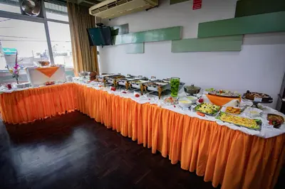 a long table with food on it in a room at Hotel Chavín in Barranca