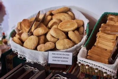 a basket of breads and breadsticks on display at Hotel Majoro in Nazca