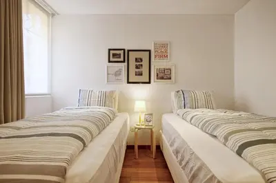 two beds sitting next to each other in a room at InkaHuset Pacasmayo in Lima