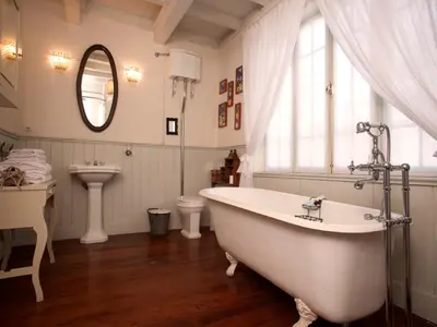 a bathroom with a tub and a sink and a toilet at Quinta Miraflores Boutique Hotel in Lima