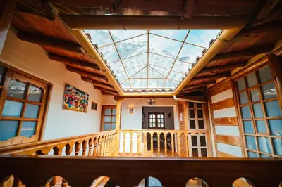 an attic view of a building with a skylight at Picaflor Tambo Guest House in Ollantaytambo