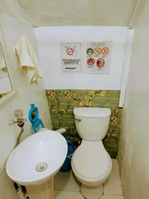 a small bathroom with a toilet and a sink at BiosWild in Cusco