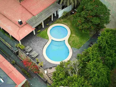 an overhead view of a large swimming pool in a yard at Empedrada Ranch & Lodge - Hotel Asociado Casa Andina in Caral