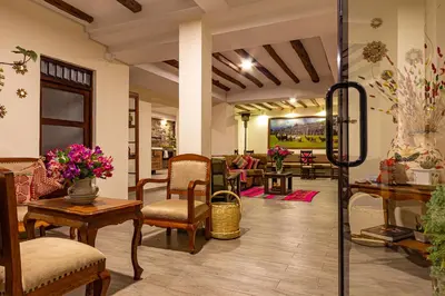 a lobby with chairs and tables in a store at Luna House Cusco in Cusco