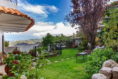 a garden with a view of the ocean at Luna House Cusco in Cusco