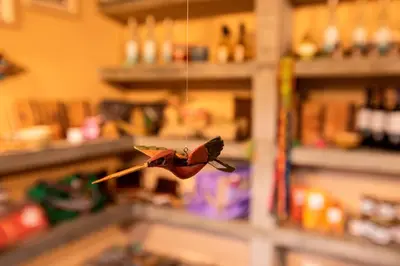 a bird ornament hanging from a string in a store at La Confianza Hotel in Lunahuaná