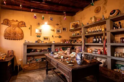 a room with a table and shelves of items at La Confianza Hotel in Lunahuaná