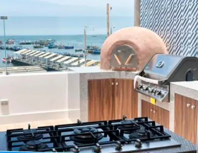 a kitchen with a stove top and a oven at Casa Paracas in Paracas