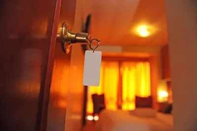 a door with a tag attached to it with a room at Hotel Waynapicchu in Cusco