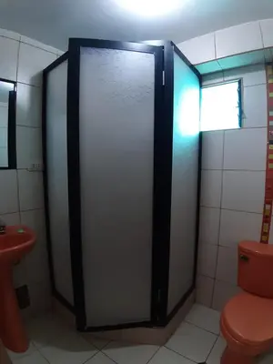 a bathroom with a shower stall with a toilet at Hatun Quilla in Cusco