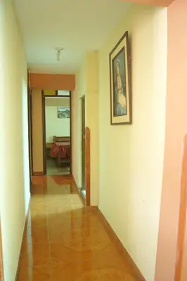 a hallway of a house with a painting on the wall at Hatun Quilla in Cusco