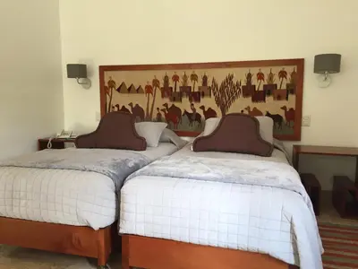 two beds sitting next to each other in a room at Zen Home & Garden House in Cieneguilla