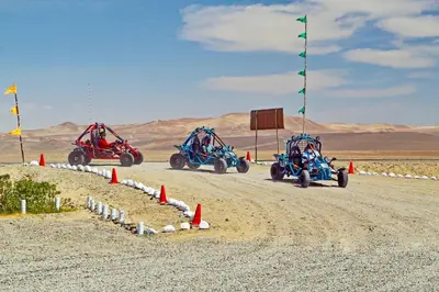a group of four four wheelers on a dirt road at Solé Paracas in Paracas