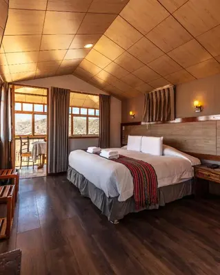 a bedroom with a large bed in a room at MOAF Cusco Boutique Hotel in Cusco