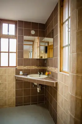 a bathroom with a sink and a mirror at MOAF Cusco Boutique Hotel in Cusco
