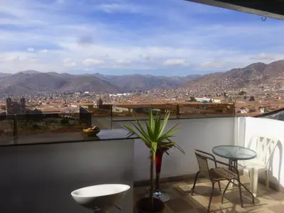 a balcony with a view of a city at Hostal Casa Del Inka in Cusco