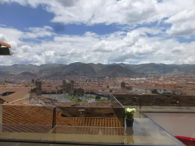 a view of a city from the roof of a building at Hostal Casa Del Inka in Cusco