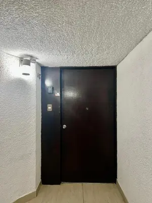 a black door in a room with a ceiling at Maywa at Central Miraflores in Lima