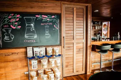 a restaurant with a chalkboard on the wall at Hotel Heidinger in Oxapampa