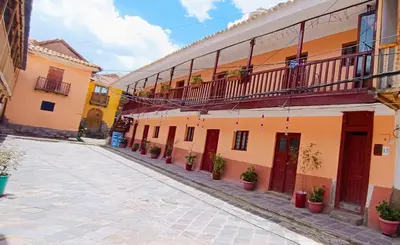 a street in an old town with buildings at Casa Anais y Nicolas económico in Cusco