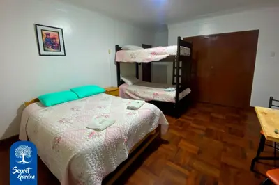 a bedroom with a bed and a bunk bed at Secret Garden in Cusco