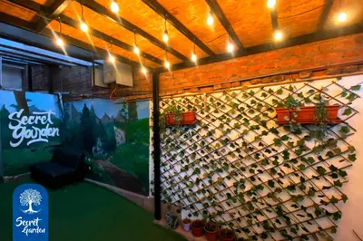 a wall with a bunch of wine bottles at Secret Garden in Cusco