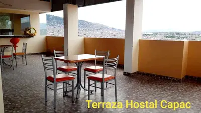 a restaurant with a table and chairs with a view at Hostal Capac in Ayacucho