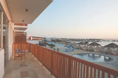 a balcony with a view of a swimming pool at San Agustin Paracas in Paracas