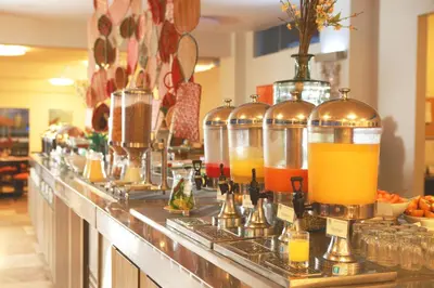 a bar with several bottles of orange juice at San Agustin Paracas in Paracas
