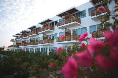 a rendering of a building with balconies and pink flowers at San Agustin Paracas in Paracas