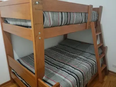 a couple of bunk beds in a room at Jirón Tarapacá 398, La Punta - Callao in Lima