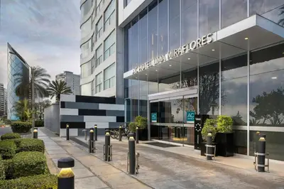 a building with a sign on the side of it at AC Hotel by Marriott Lima Miraflores in Lima
