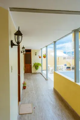 a hallway of a house with a view of a pool at Hospedaje Zaragoza in Ayacucho