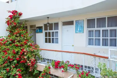 a house with a christmas tree on a balcony at Hospedaje Zaragoza in Ayacucho