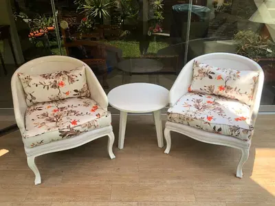 two chairs and a coffee table in a window at Casa Campo Machu Picchu - Club Los Girasoles, Chaclacayo in Chaclacayo