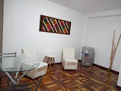 a room with a table and a glass table and a machine at Peruvian Family Hostal Miraflores in Lima