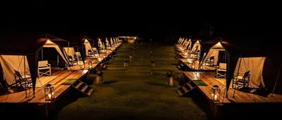 a row of rows of tents with lights on them at Glamping Chaska Ocupi in Urubamba