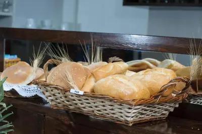 a basket of loaves of bread on a table at Posada San Blas in Cusco