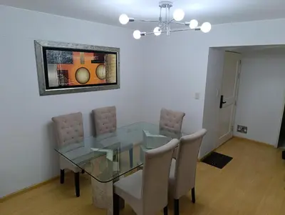 a dining room with a glass table and chairs at MIRAFLORES APART-10Beds-11Persons-Pool-Grill-Garage-Near Kennedy Park in Lima