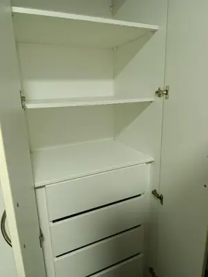 a white closet with white drawers and shelves at MIRAFLORES APART-10Beds-11Persons-Pool-Grill-Garage-Near Kennedy Park in Lima