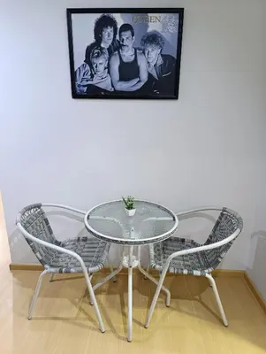 a glass table and two chairs in a room at MIRAFLORES APART-10Beds-11Persons-Pool-Grill-Garage-Near Kennedy Park in Lima