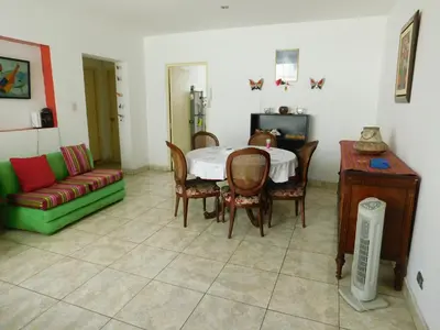 a living room with a table and chairs and a couch at Teté in Lima