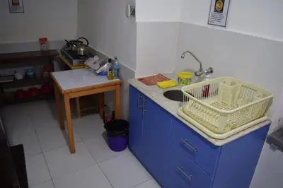 a kitchen with a sink and a counter top at Carlos Guest House 3 Cusco in Cusco