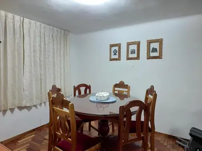 a dining room with a table and chairs at Mandalas Cusco in Cusco