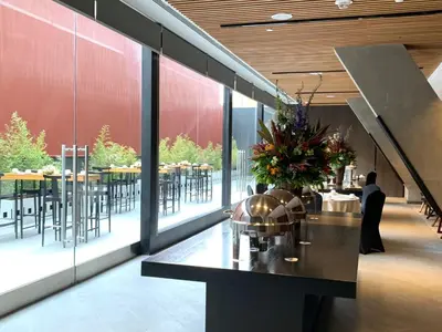 a restaurant with a table with flowers on it at Holiday Inn - Lima Miraflores by IHG in Lima
