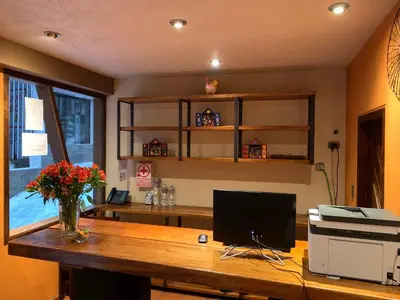 a desk with a computer on top of it at 1911 in Machu Picchu