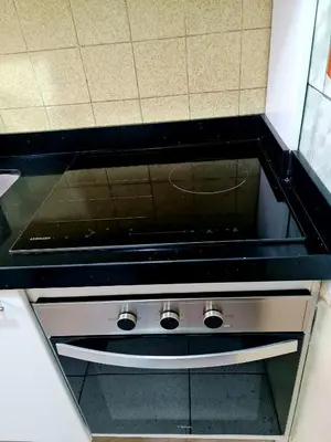 a stove top oven sitting inside of a kitchen at Miraflores Dpto 2 dorm. espaciosos 4 huéspedes 90m2 in Lima
