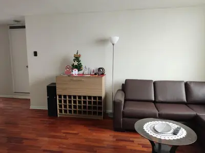 a living room with a couch and a table at Blue Coast Lima apart Peru in Lima