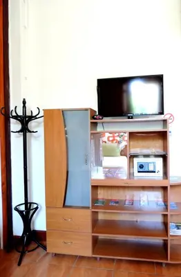 a entertainment center with a flat screen tv on it at Lima Wari Hotel Boutique in Lima