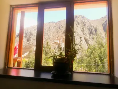 a window with a view of a mountain at Casa Patacalle in Ollantaytambo